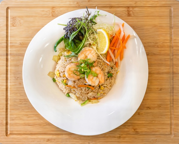 Vietnamese fried rice with egg and fresh vegetables