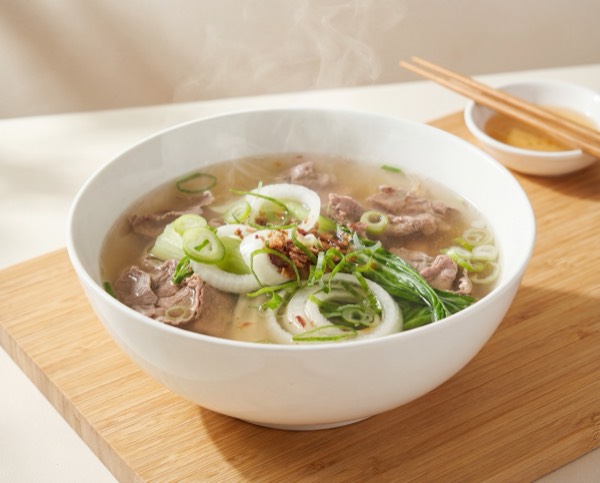 Beef pho with fresh herbs and rice noodles